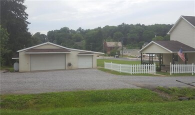 Detached garage with electric, heat and window A/C