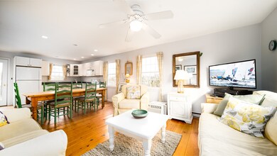 Living/Dining/Kitchen with pantry and door to deck.