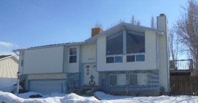 Split foyer home featuring a chimney