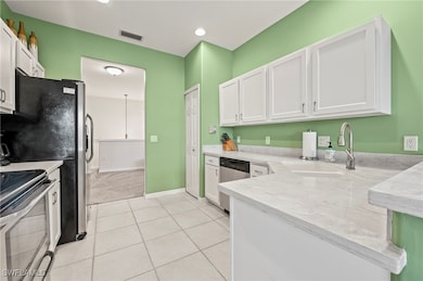 Kitchen featuring range with electric stovetop, wh