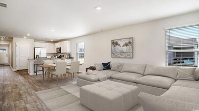 Virtually staged Living area featuring wood finished floors and recessed lighting