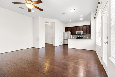 Unfurnished living room with dark wood finished f