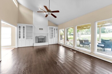 The spacious living room has high vaulted ceilings