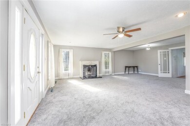 Large great room with gas fireplace, new fan, carp