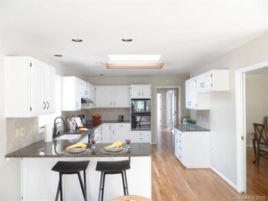 Shot from Breakfast area through kitchen to hall w