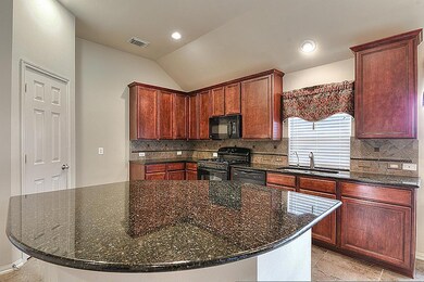 Large center island with seating space. Perfect for entertaining and serving those large meals.