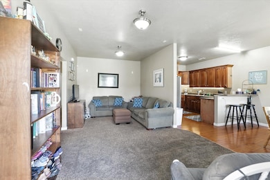 Living area with wood finished floors and baseboards