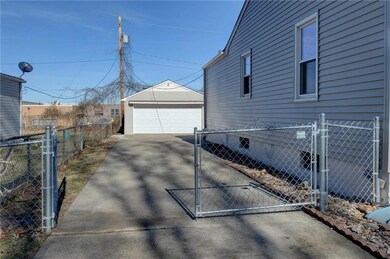 Side view. Long driveway for plenty of parking.