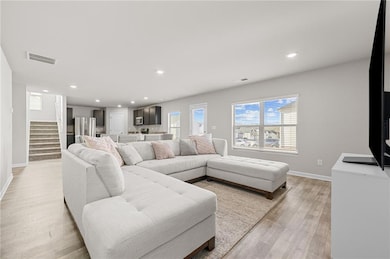 Living room featuring light wood style flooring