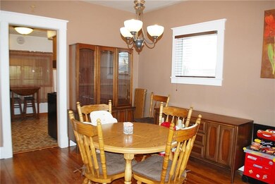 Dining room (13x11) with hardwood floors and view 