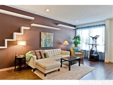 Living room is updated with laminate hardwood floo