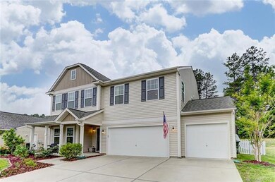 Covered Front Porch and Three-Car Garage