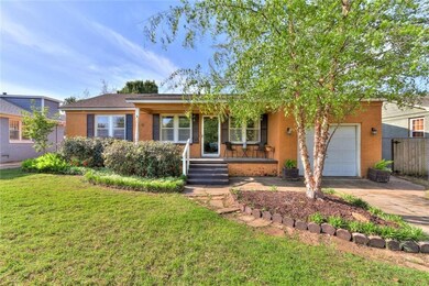 Landscaping in front yard. Sunny front porch.