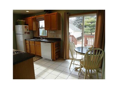 . Sunny kitchen with tile flooring