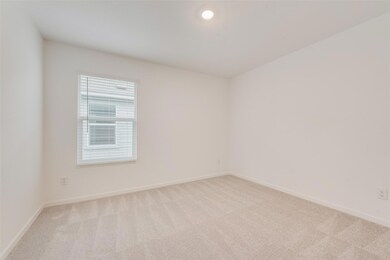 Unfurnished room with baseboards and light colored
