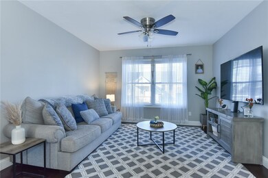open concept living room to dining room to balcony