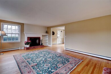 Living room, brick fireplace, wood surround, overs