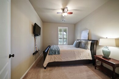 The guest bedroom has an en suite full bathroom and walk in closet.