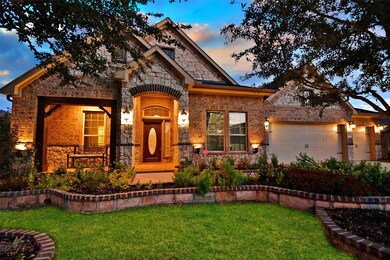 This home has so much curb appeal with the raised flower beds adorned with stone pavers and well manicured landscaping