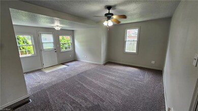 Unfurnished room featuring ceiling fan, light carp