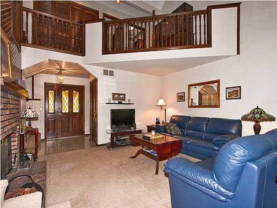 Spacious living room w/ woodburning fireplace...up