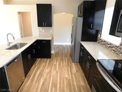 The Kitchen Has Granite Countertops, Tile Backspla