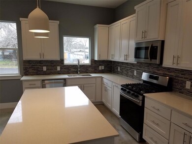 Kitchen featuring a sink, stainless steel applian