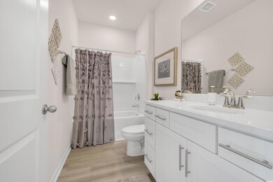 Full bathroom with visible vents, shower / tub com