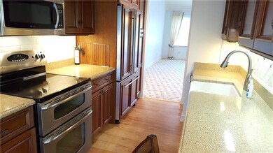 Completely remodeled kitchen with cherry cabinetry