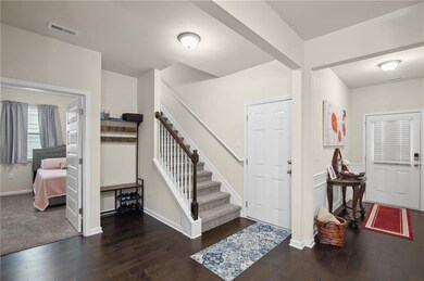 Entryway featuring wood finished floors and stairway