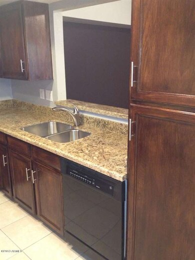 Dark Cabinets and Black Appliances