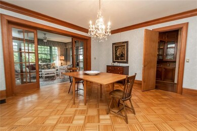 Formal dining room off foyer opens to sun room and