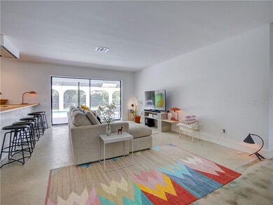 Living Room with Sliders that  Open to Deck/ Pool