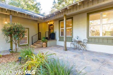 FRONT PORCH AND VERANDA WITH NEW ORLEANS COURTYARD FEEL