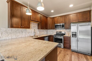 Granite Counters, Designer Lighting, Stainless Ste