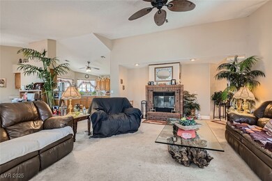 Living area with vaulted ceiling, carpet floors, a