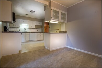 Opens to kitchen