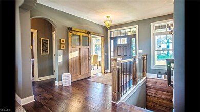 View of foyer. Wood Flooring - Barn Door entry to 