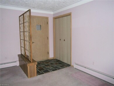 Slate entryway with closet.