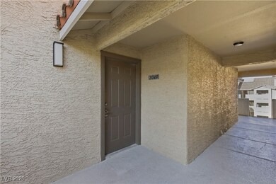 Doorway to property featuring stucco siding
