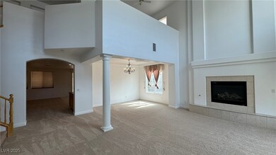 Unfurnished living room featuring carpet, a high c