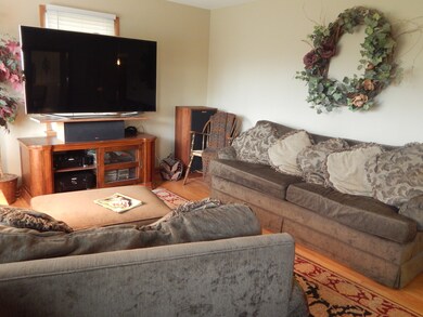 Living room features lovely hardwood floors and po
