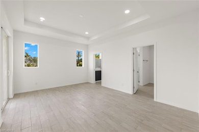 Unfurnished room with baseboards, light wood-type 
