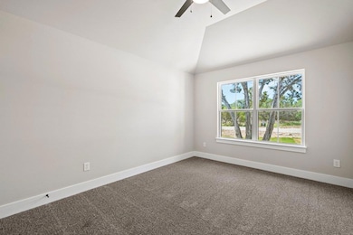 Unfurnished room with a ceiling fan, baseboards, 