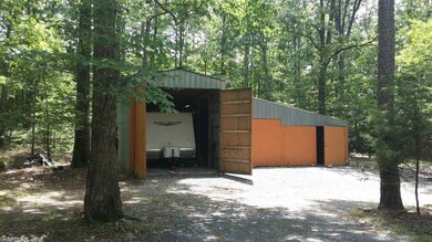 3-bay Garage. Can hold 35' motor home in left bay.