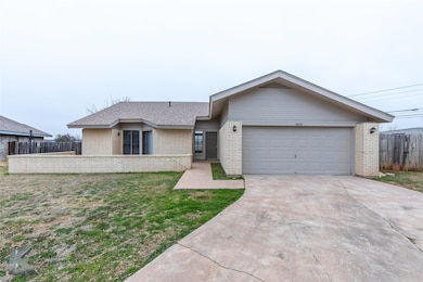 Ranch-style house featuring a garage