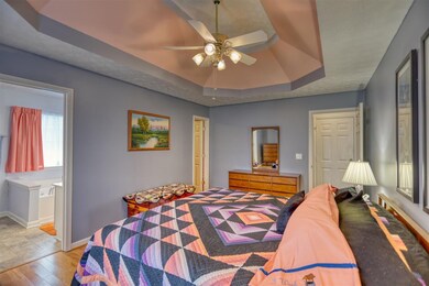 Master bedroom view shows bath entry and cedar closet entry by the dresser.