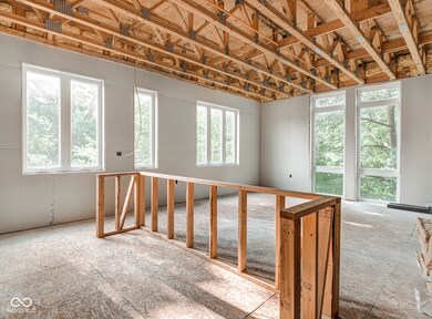 Upper level kitchen/living area with bedroom and bathroom toward the back of unit