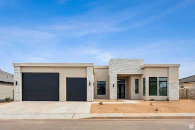 Contemporary house featuring an attached garage, stucco siding, stone siding, and concrete driveway