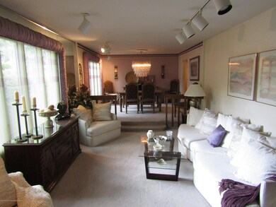 Living room with step up dining room.